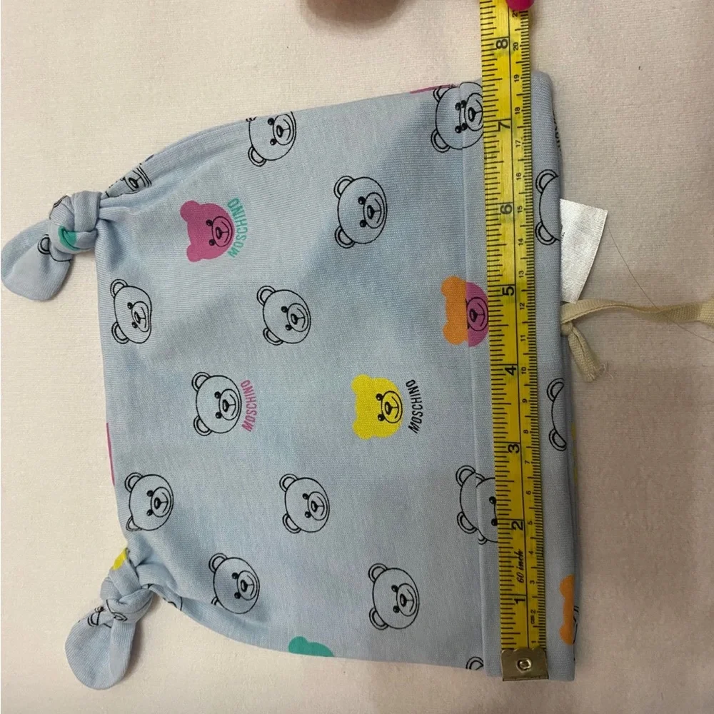 Matching set bib and hat baby Moschino